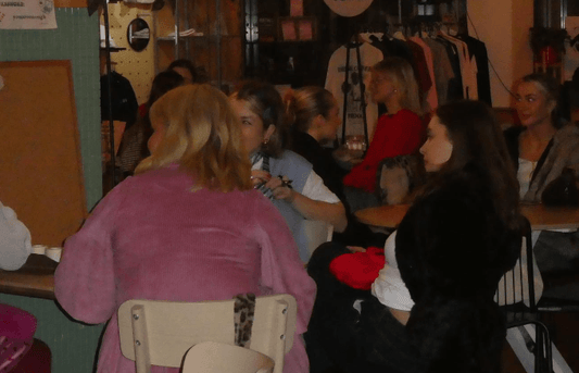 An image of a group chatting at a bar