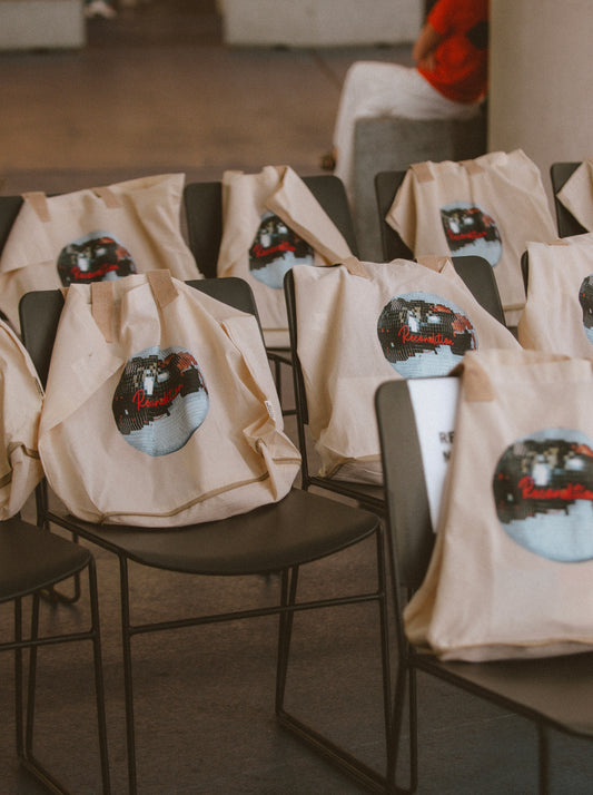 a group of chairs with bags on them