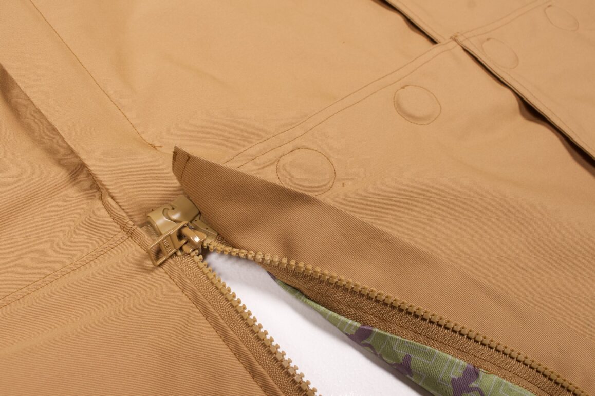 Zoomed in image of the Recondition Adaptable Trench coat.