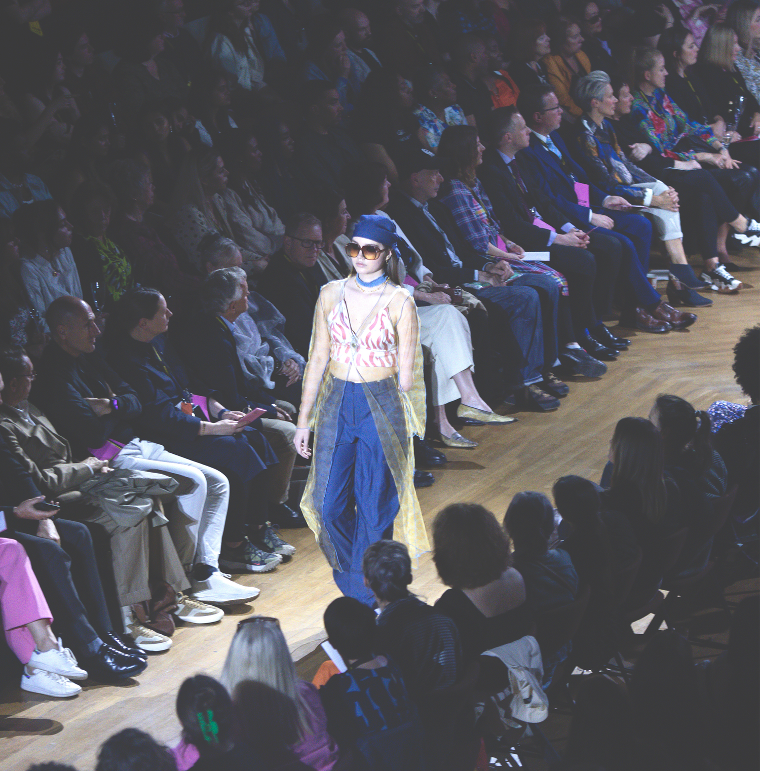 One model with a disability walking the runway in a full Recondition look.